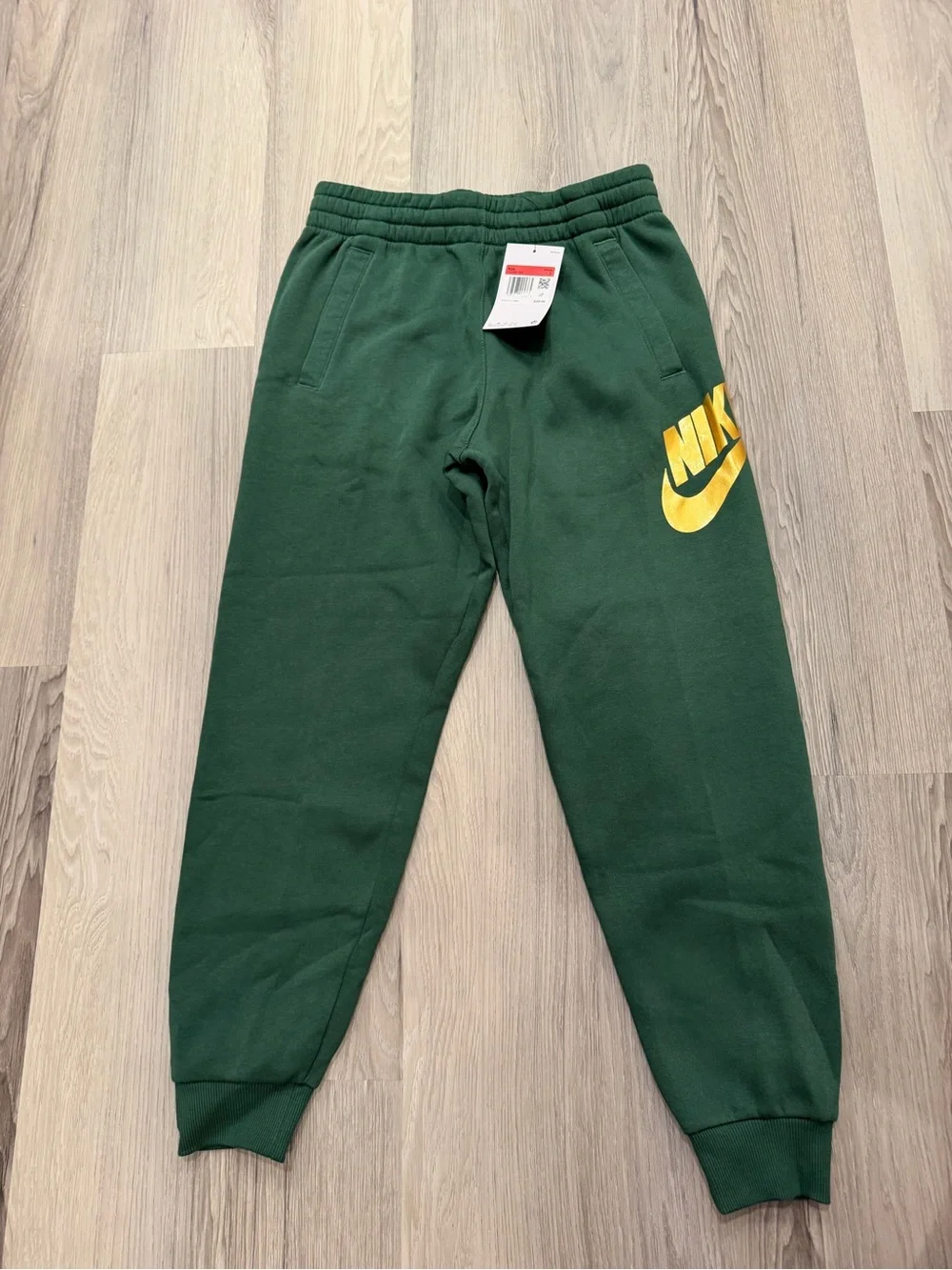 Nike Kids Dark Green Joggers with Gold Logo